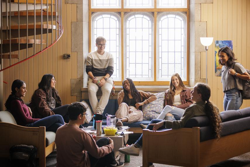 Seven students congregate in a student residence lounge on the U of G campus.